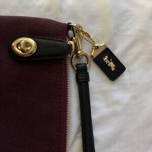 Coach Burgundy Canvas Wristlet with Black Strap and Gold Hardware Accent